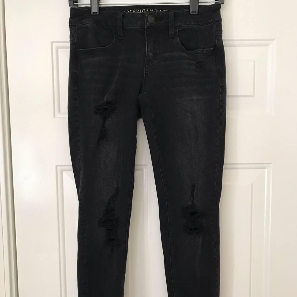 Faded black ripped denim skinny jeans